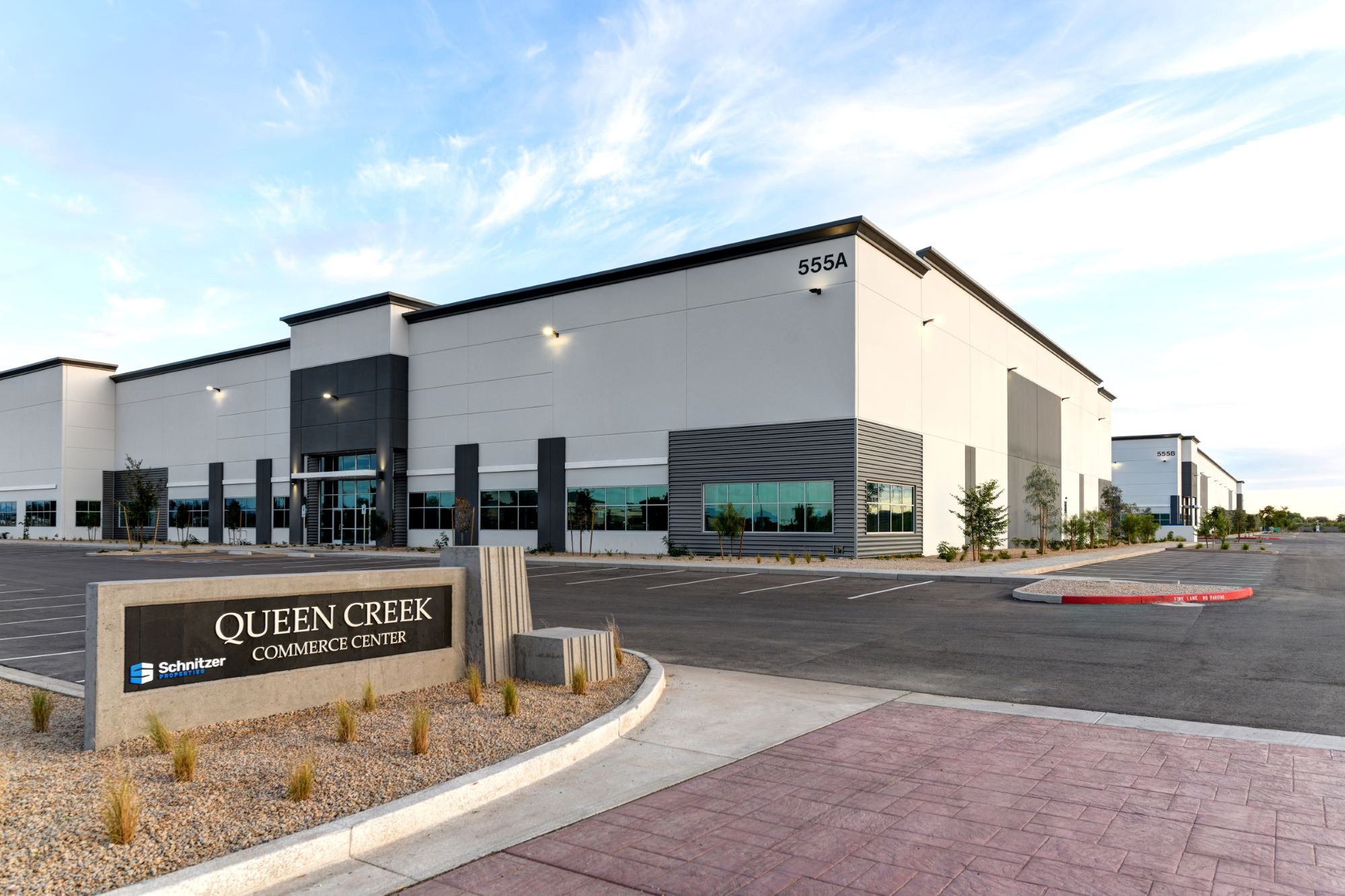 Queen Creek CC monument sign and building in the background