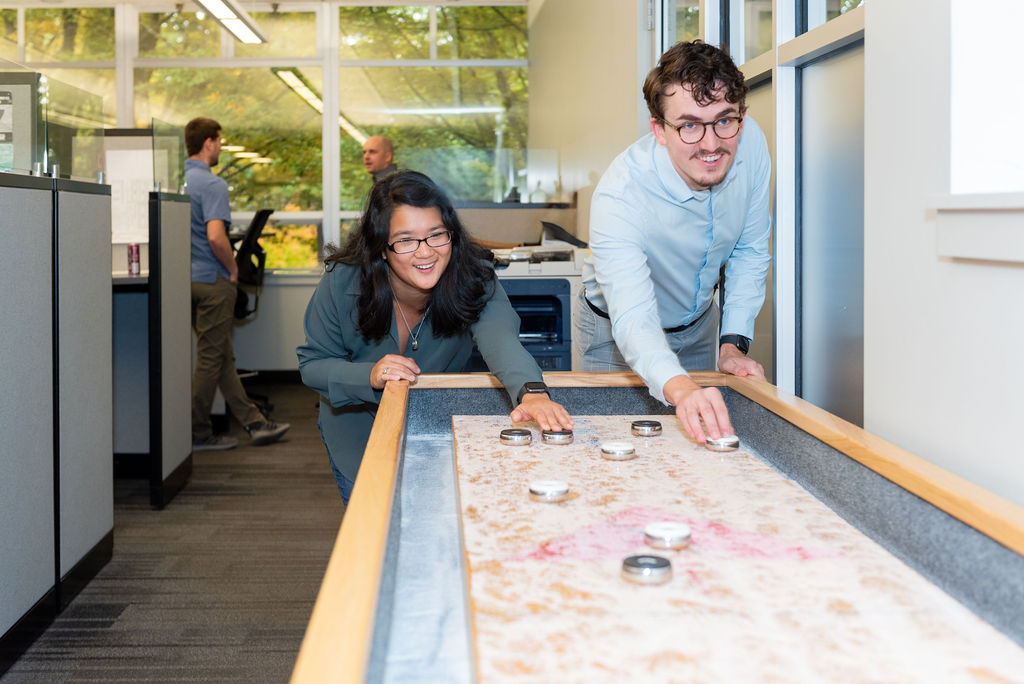 Staff enjoying the VLMK Shuffleboard VLMK Staff playing shuffleboard